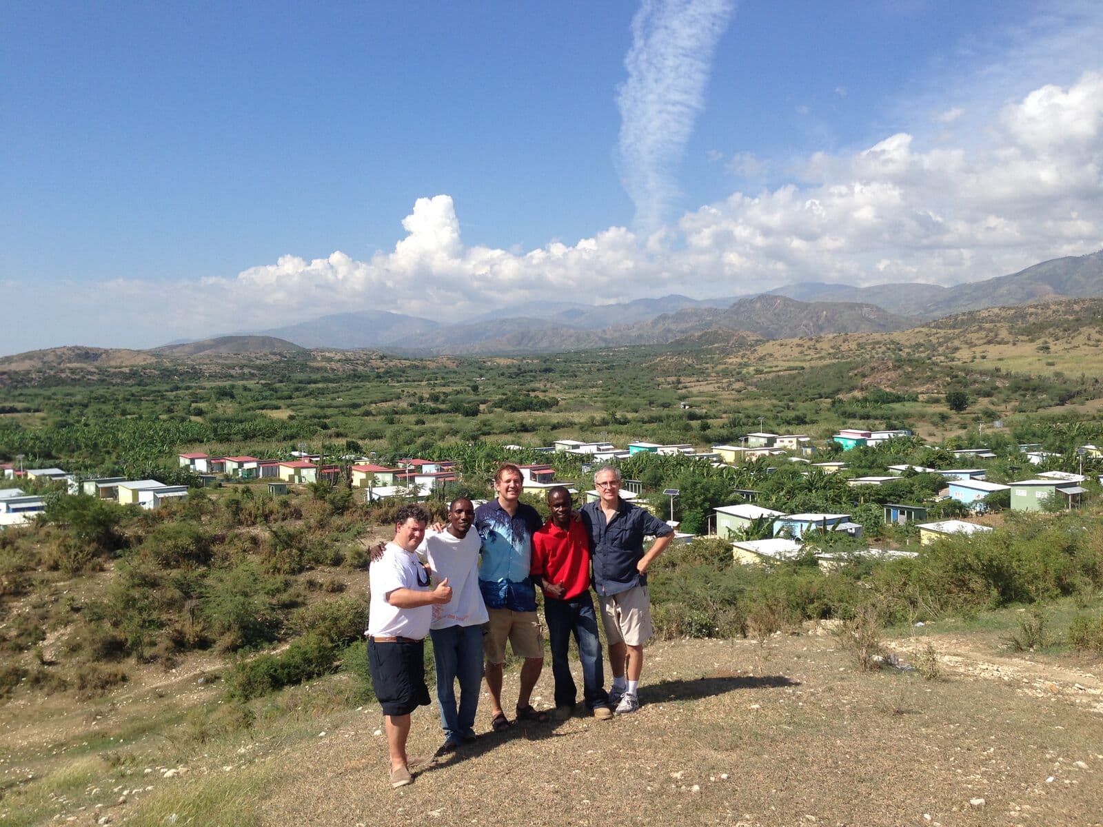 IDE team overlooking the deaf village built in Haiti after the 2010 earthquake
